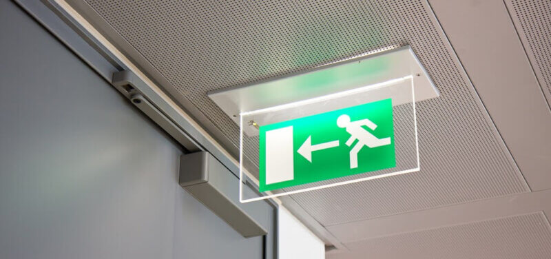 emergency exit sign near a door in a building